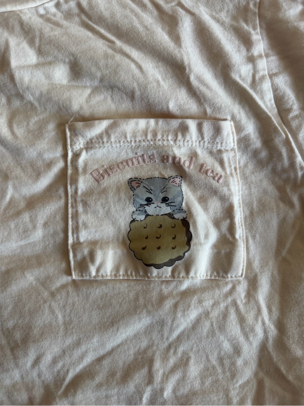 Cream Pocket Tee with Cute Kitten Biscuit Graphic